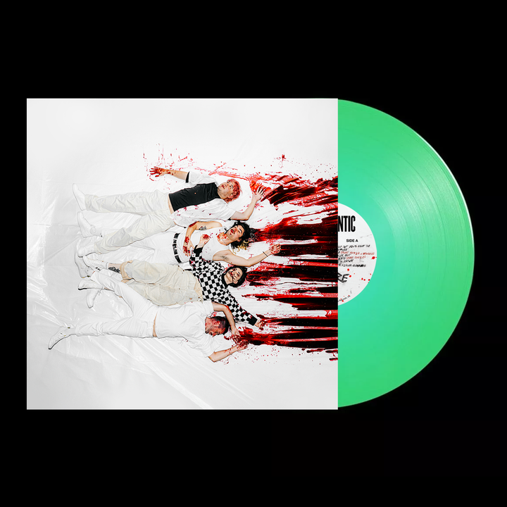 Five people in white lie on a red-splattered surface beside a green vinyl labeled Stand Atlantic. The record partially covers the right side, creating a striking contrast.