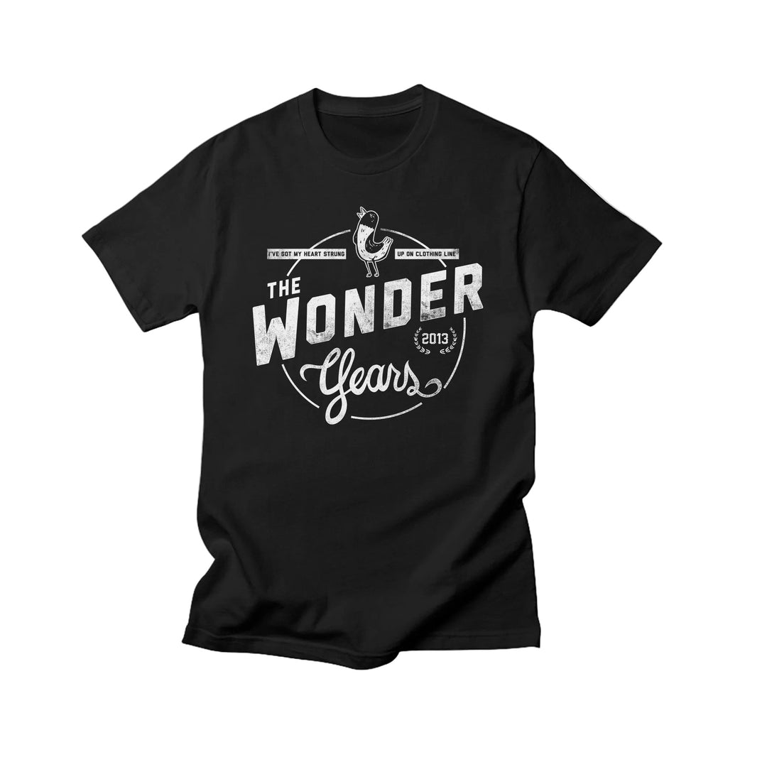 Vintage-inspired black T-shirt by The Wonder Years featuring a white “THE WONDER Years 2013” graphic, small banners, and a guitar illustration at the top center. Perfect for fans of classic Comfort Colors style.