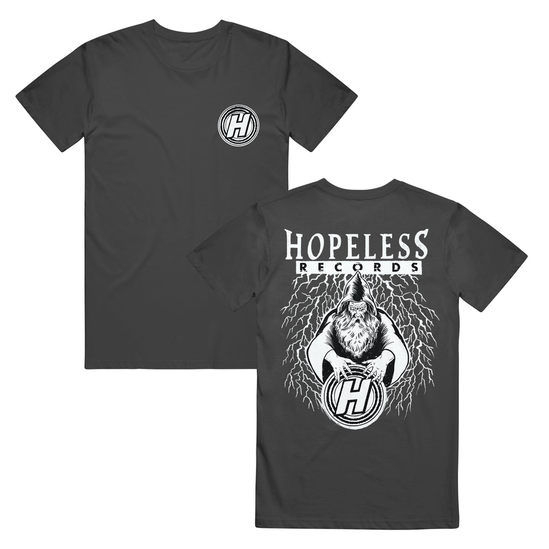 Hopeless Records black Shakawear t-shirt with a small H logo on the front left chest. The back shows Hopeless Records text above an illustrated howling wolf with lightning, gripping a large H logo.