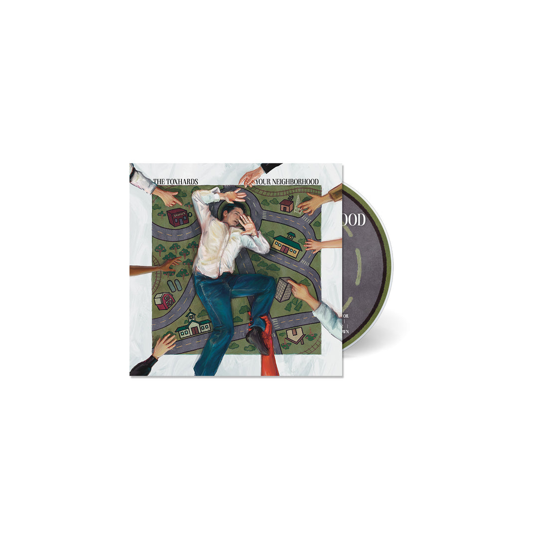 A CD release by The Toxhards, housed in a case showing a man in formalwear lying on a map-like surface with outstretched hands nearby; the partially visible CD hints at tracks from Erwins Orchard.