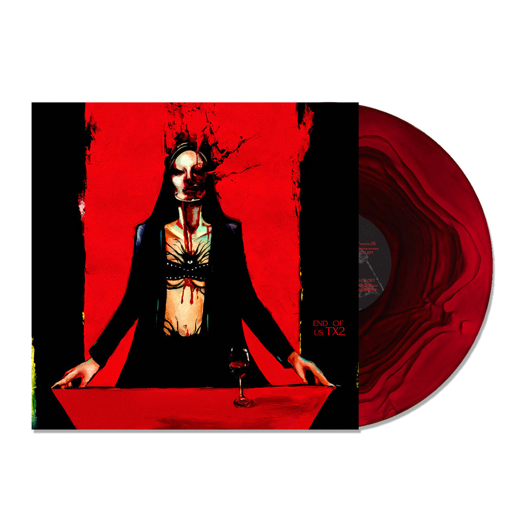 The TX2 limited edition vinyl features a striking red and black marbled design. Its cover showcases surreal art of a dark figure in a suit with red wine on a vivid red background—a bold addition to any music collection.