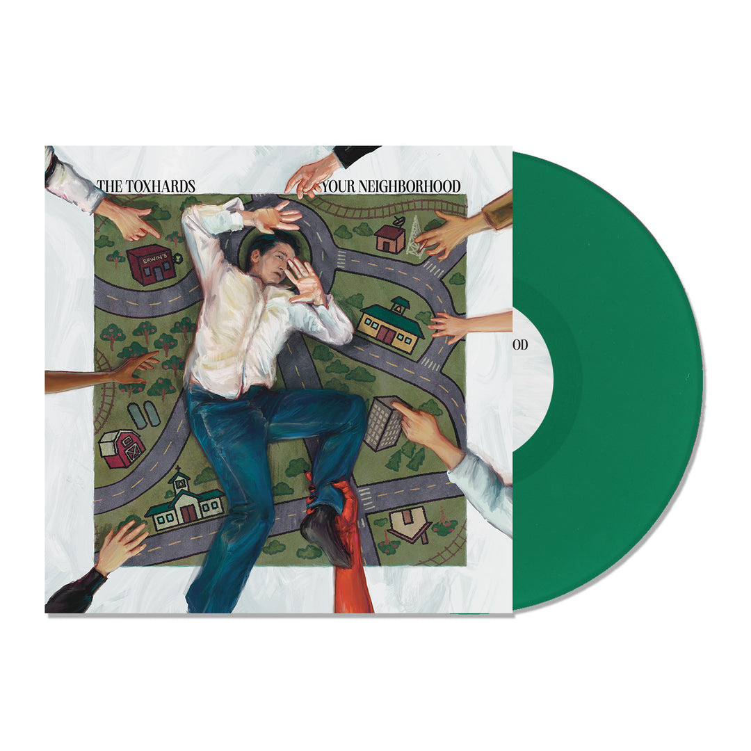 A green vinyl record by The Toxhards is pictured beside its cover, showing a man on a playmat of neighborhood roads as hands point at him. The cover reads “THE TOXHARDS” and “IN YOUR NEIGHBORHOOD.” Vinyl release date coming soon.