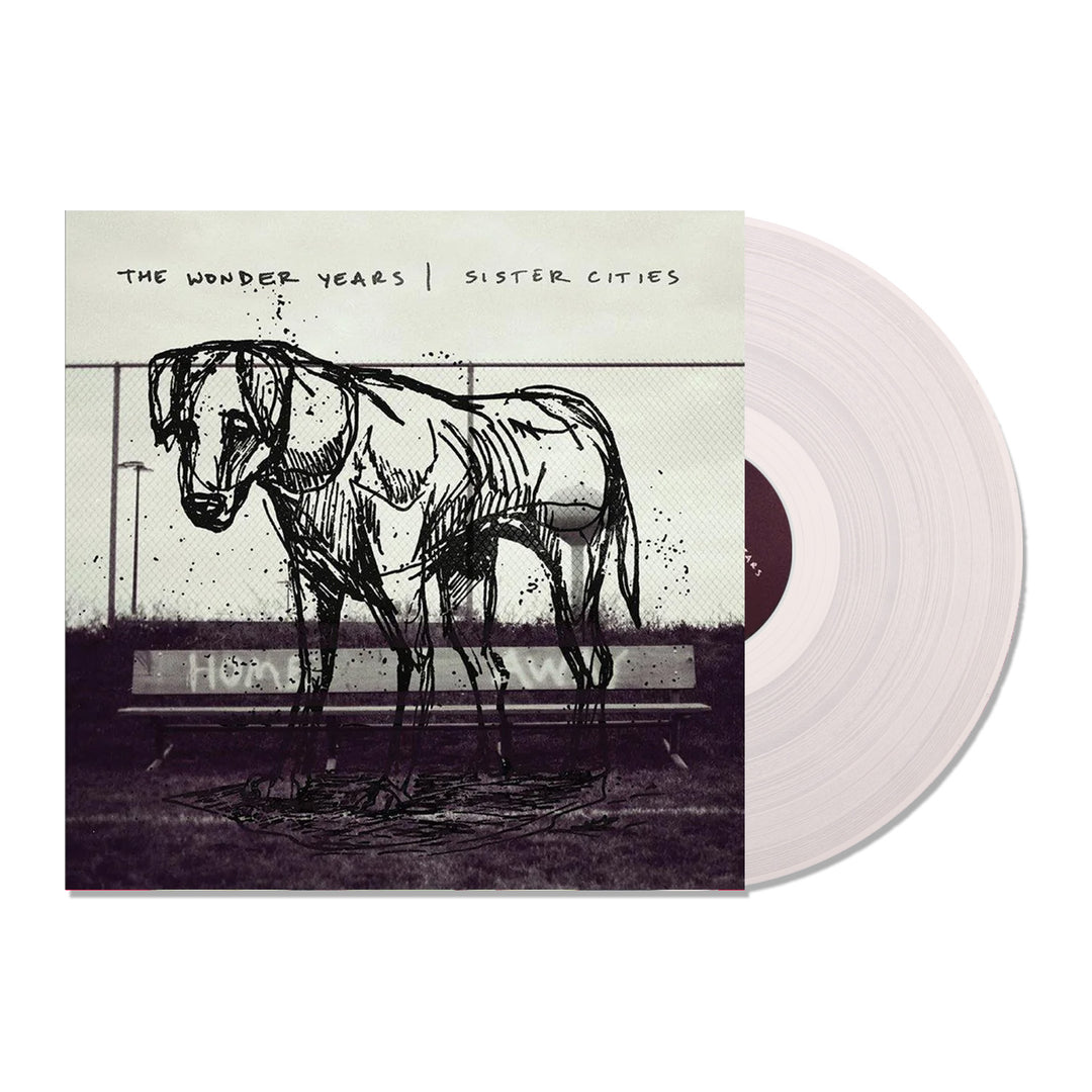 Album cover for Sister Cities by The Wonder Years, showing a dog in front of a bench. The LP from The Wonder Years is pressed on ultra clear vinyl, partially visible next to the cover.