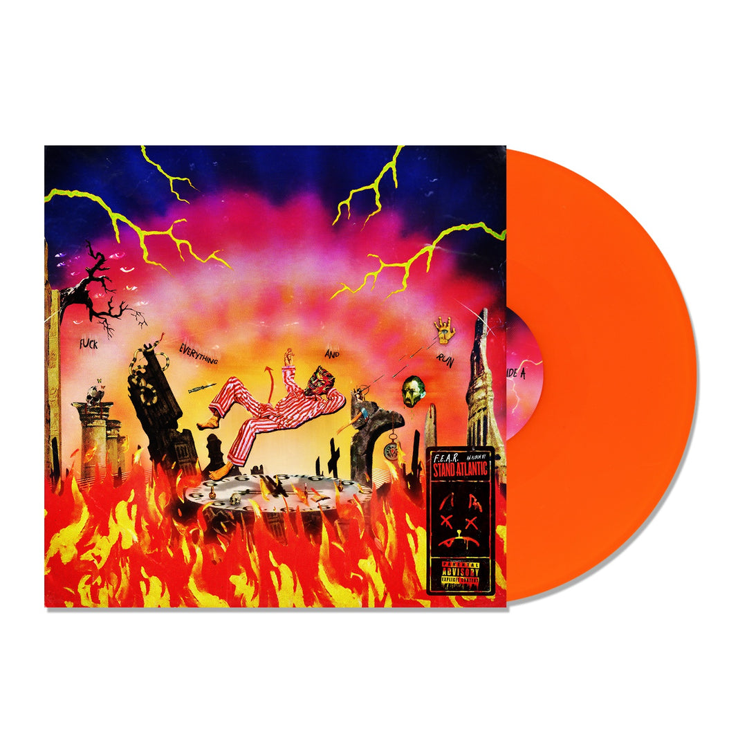 A neon orange LP slides out of a colorful Stand Atlantic album cover, showing a cartoon figure in striped pajamas falling into flames amid burning buildings, skeletons, and a surreal sky. Brand: Stand Atlantic.
