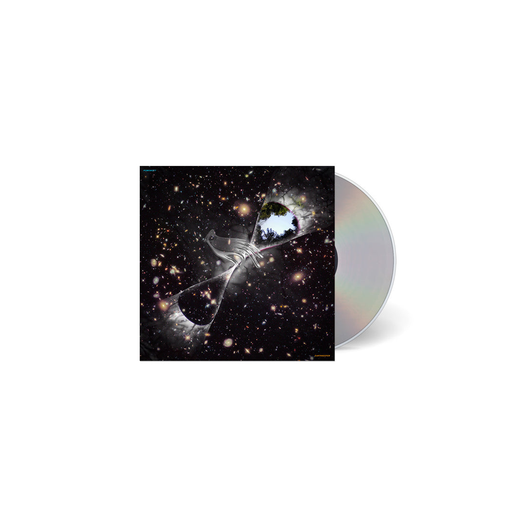 A Pinkshift CD and its case display cover art of outer space, stars, and an hourglass containing Earth with a hand reaching upward. The partially visible CD reflects light. Release date details appear on a white background.