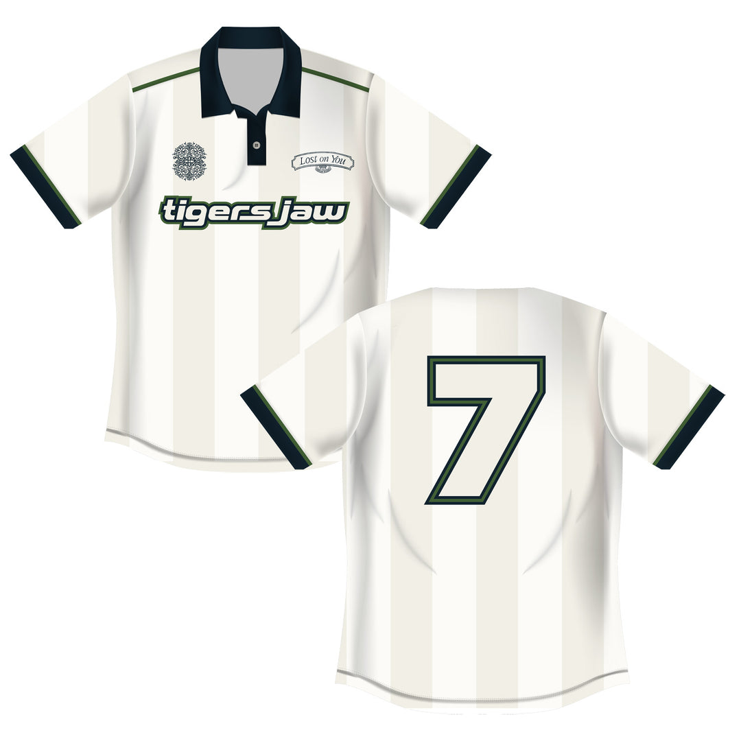 The Tigers Jaw white soccer jersey features thin vertical stripes, a dark collar and sleeve trim, number 7 on the back, tigers jaw text on the front, a circular crest, and a rectangular Lost On You logo for standout sportswear.