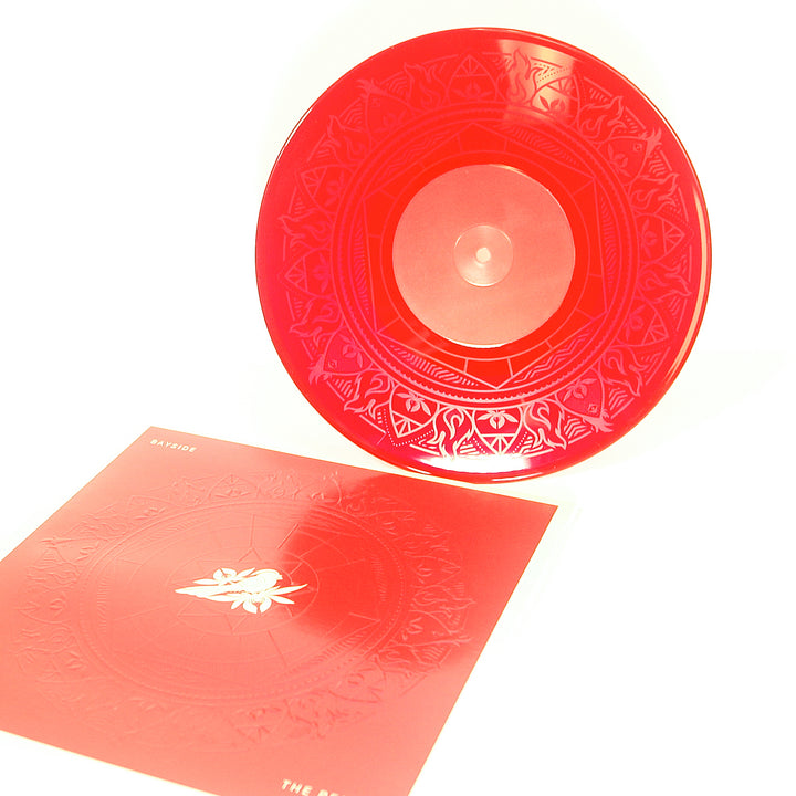 Vinyl album cover for Bayside "The Red EP" on a white background. Cover is Red with a Mandala. White bird on a flower centered. White Text in the corners "Bayside" &amp; "The Blue EP". Vinyl is Transparent Red.