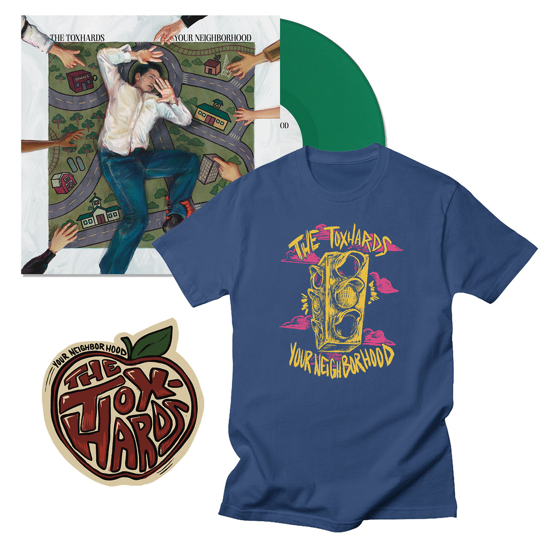 The Toxhards music bundle includes a green vinyl, an album cover showing a man with cartoon hands and houses, a liberty blue tee featuring a traffic light and Your Neighborhood text, and an apple-scented sticker.