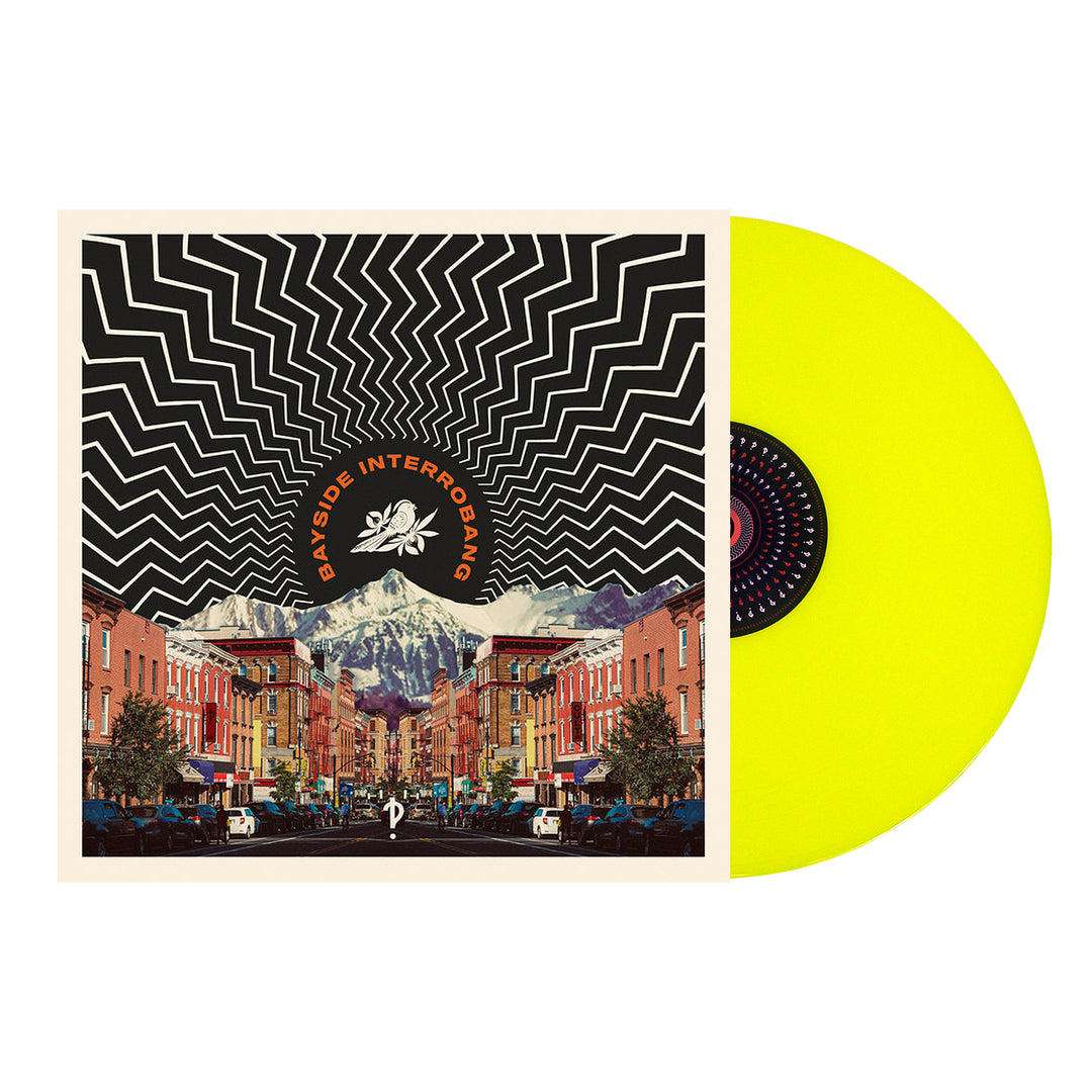 A neon yellow LP partially slides out of an album cover with a zigzag black and white pattern above a city street and mountains; BAYSIDE appears in an arch at the top.
