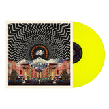 A neon yellow LP partially slides out of an album cover with a zigzag black and white pattern above a city street and mountains; BAYSIDE appears in an arch at the top.