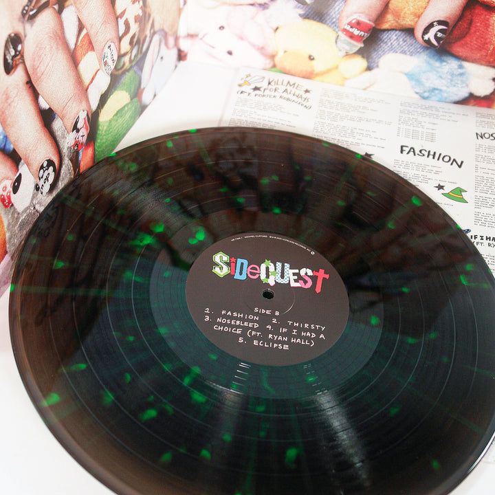 Vinyl record with a colorful label on a newspaper background