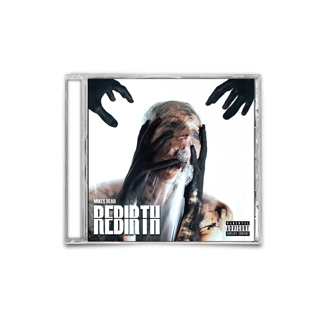 A CD cover showing a person with their face obscured by dark hands and smeared makeup, capturing the intense GRIP of inner torment. The text reads MIKES DEAD REBIRTH, reminiscent of Emmure’s raw energy, with a parental advisory label in the lower right corner.