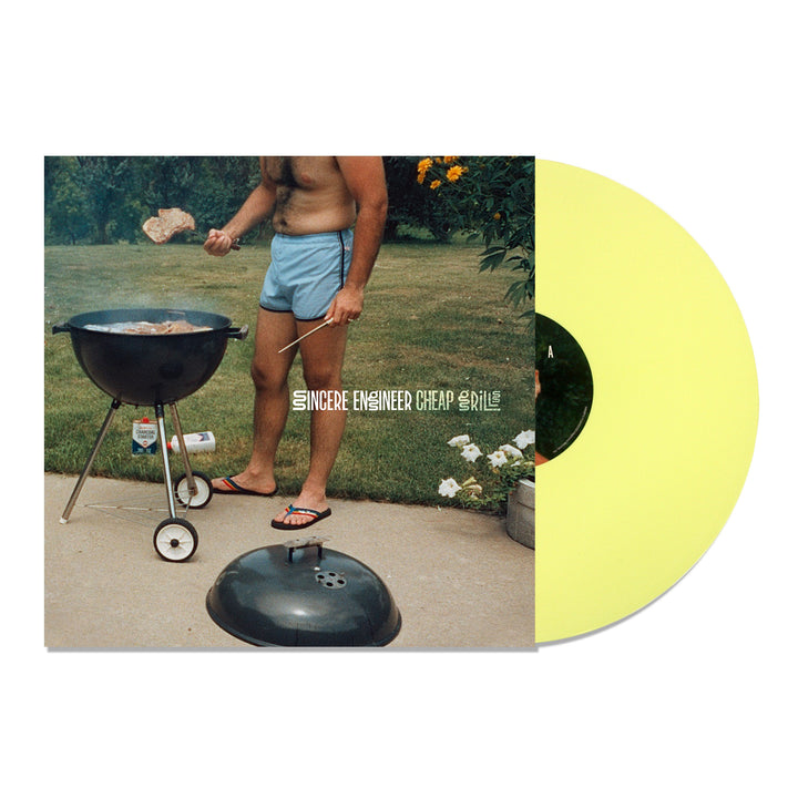 A yellow LP and cover from Sincere Engineer feature a person in blue shorts grilling on a black charcoal grill, with the album title Cheap Grills overlaying the backyard-themed image.