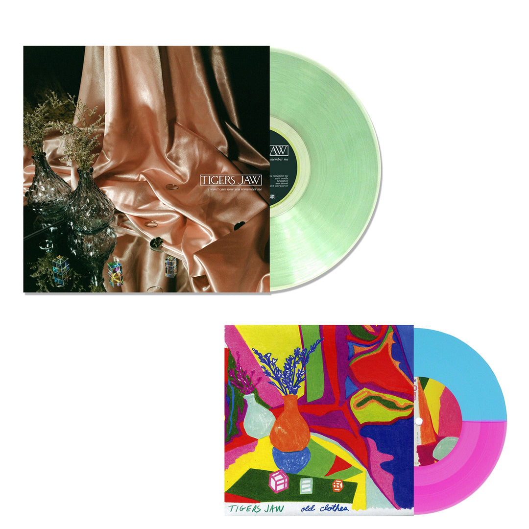 Tigers Jaw offers two Vinyl LPs: one in translucent Coke Bottle Green with a sleek glass vase cover, and the other in Old Clothes Blue Neon Split featuring a vibrant, abstract vases and flowers design.
