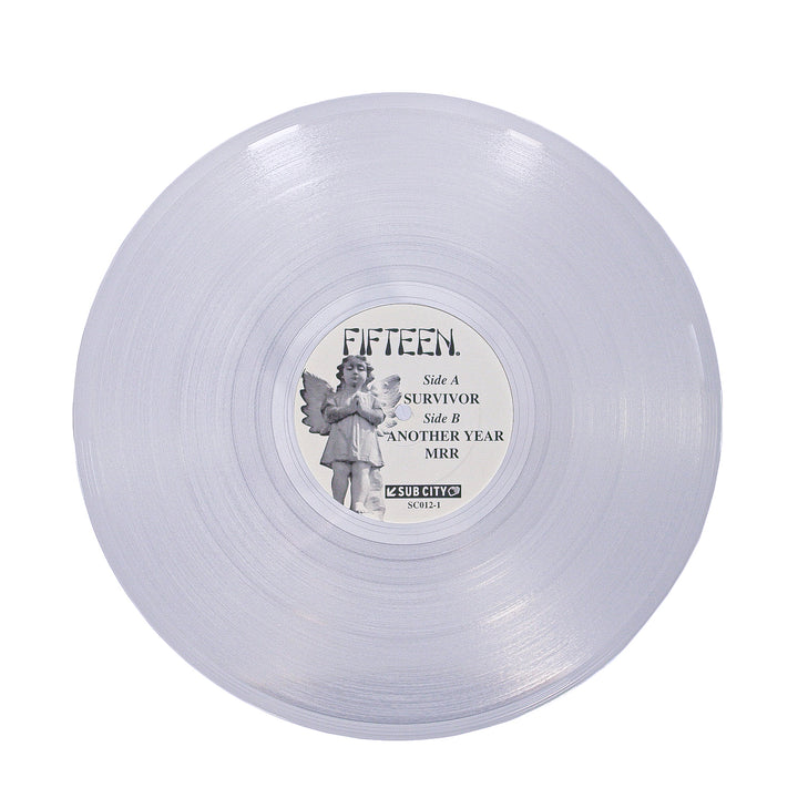 A translucent Hush Clear vinyl from Fifteen with a central angel-illustrated label reading FIFTEEN and track names: SURVIVOR, ANOTHER YEAR, and MRR.