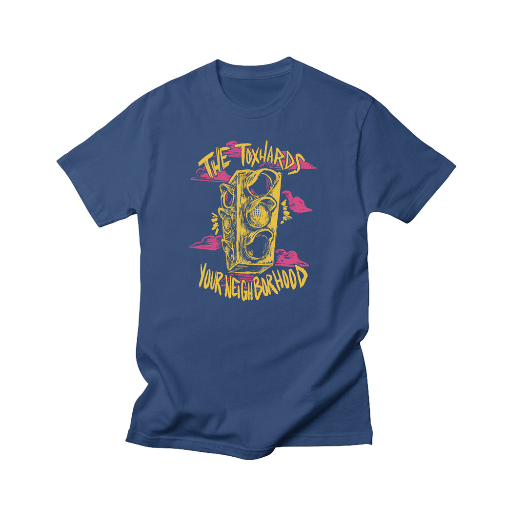 The Toxhards blue T-shirt with a yellow illustrated traffic light, pink clouds, and “The Toxhards” above and “Your Neighborhood” below in stylized yellow font. Exclusive design by The Toxhards.