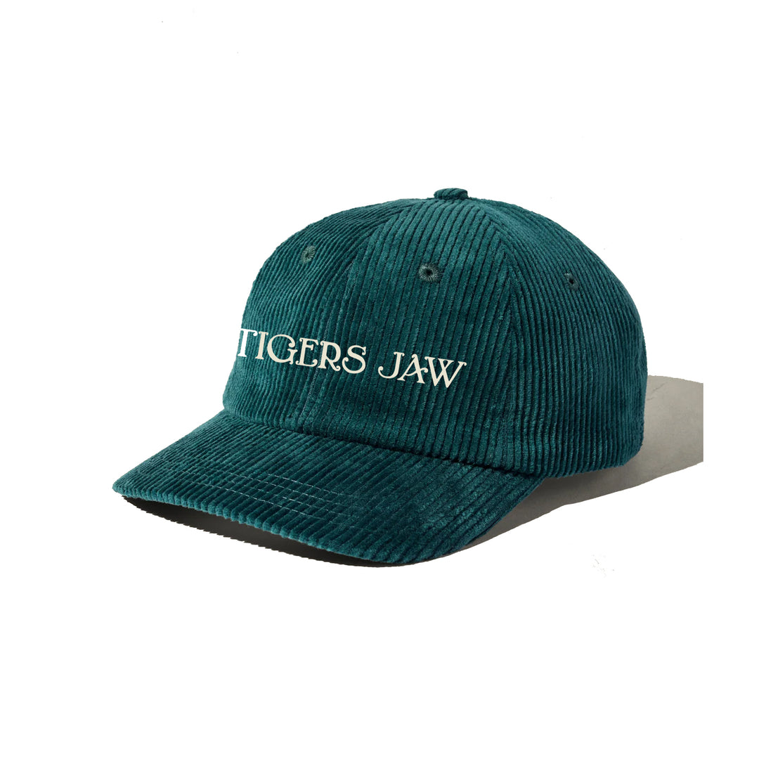 A teal corduroy baseball cap from Tigers Jaw with "TIGERS JAW" embroidered in white on the front, shown against a plain white background—ideal for fans of unique embroidered hats.