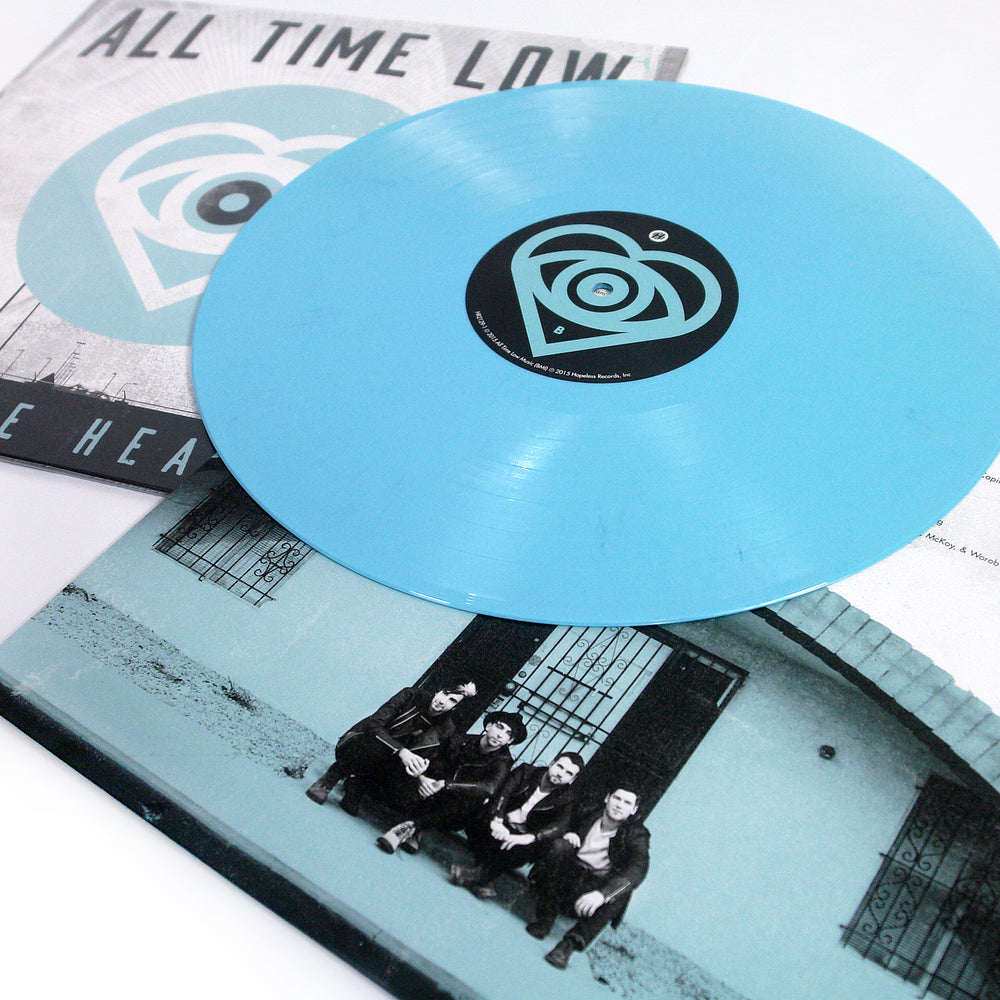 All Time Low "Future Hearts". Blue circle that contains a heart and eyeball. Showcase of Light Blue Vinyl