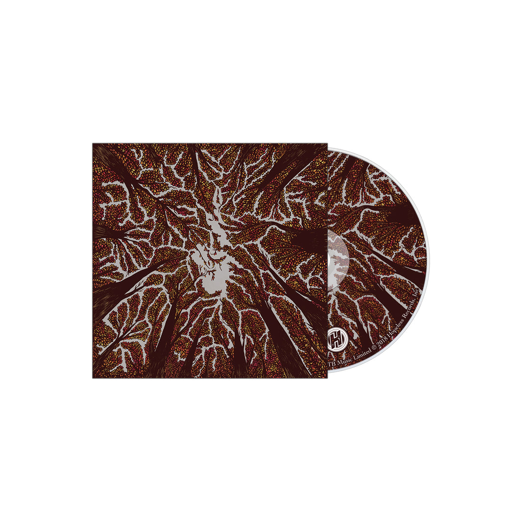 A CD partially slid from a square case adorned with abstract brown and white organic patterns, resembling branches or veins, and featuring a small circular logo in the corner—an evocative Trash Boat design.