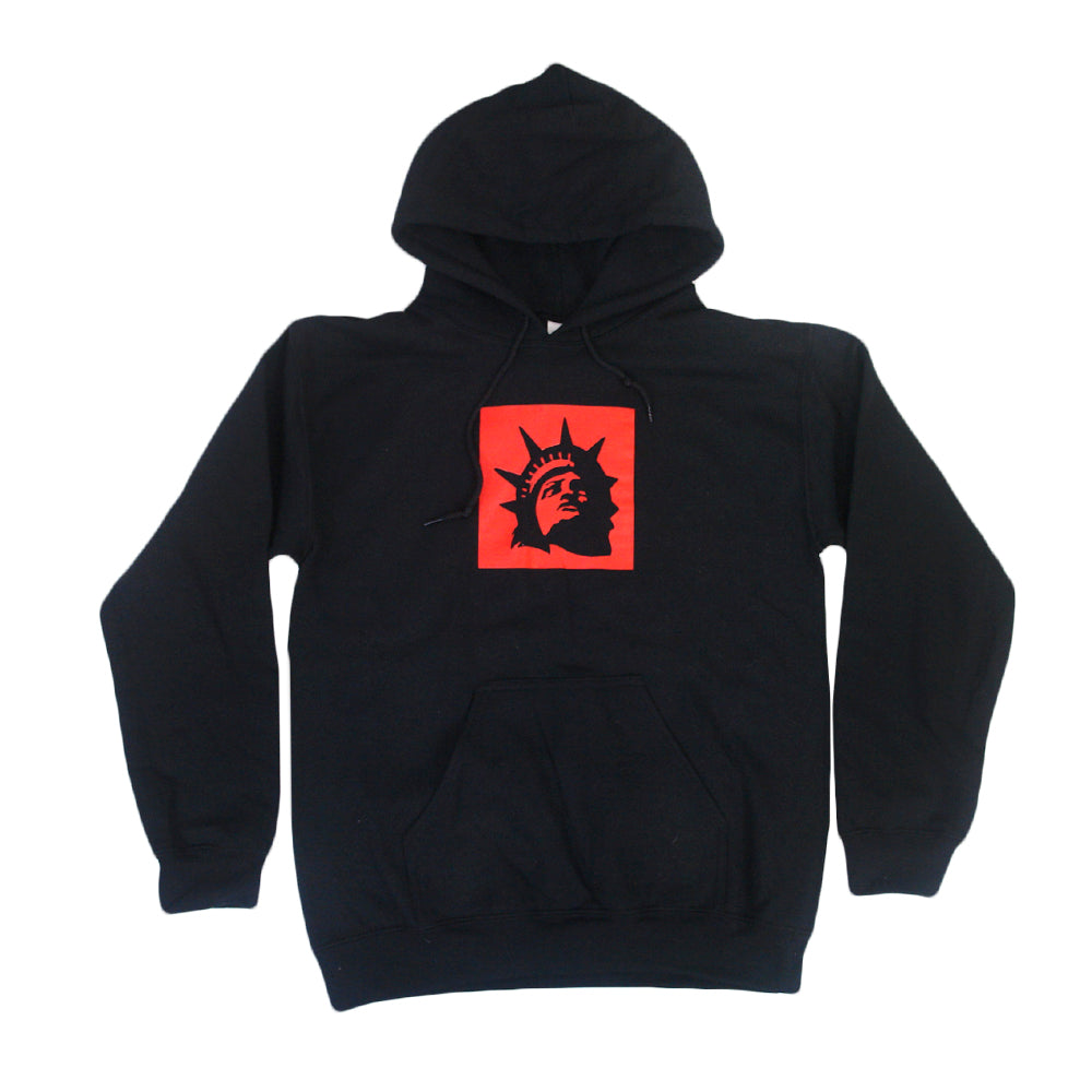 Trophy Eyes black hoodie with a front pocket, featuring a red square on the chest with a black Statue of Liberty head graphic—an iconic piece from the Liberty Square Black collection.
