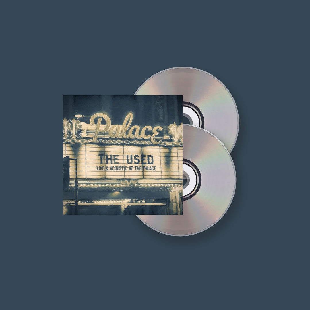 Album cover for The Used’s Live and Acoustic at the Palace shows a vintage theater marquee reading Palace and The Used, with two CDs on a dark blue background, reflecting the bands acoustic performance. Brand: The Used.