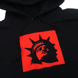 A Trophy Eyes Liberty Square Black hoodie featuring a red square graphic with a black silhouette of the Statue of Liberty’s face and crown on the front.