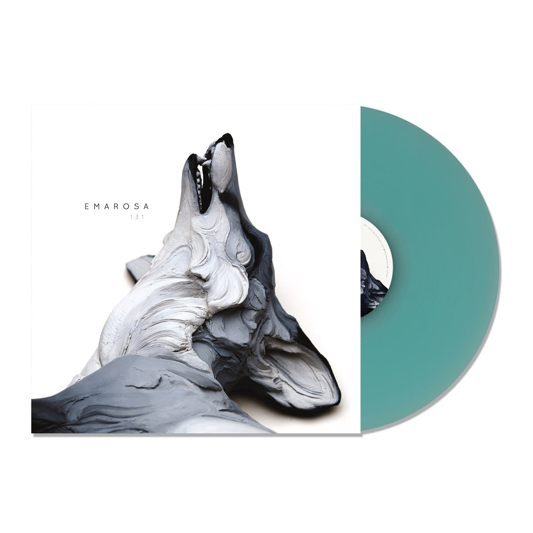 A teal vinyl peeks from its sleeve, which displays abstract gray and white sculpted wolf heads for Emarosa’s limited edition 131 album—an exclusive collectors piece that hints at special tracks inside.