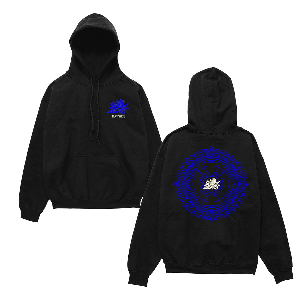 Black pullover on a white background. Front shows a blue bird on a flower in red over white text "Bayside". Back print shows a blue red Mandala with a white bird on a flower centered.
