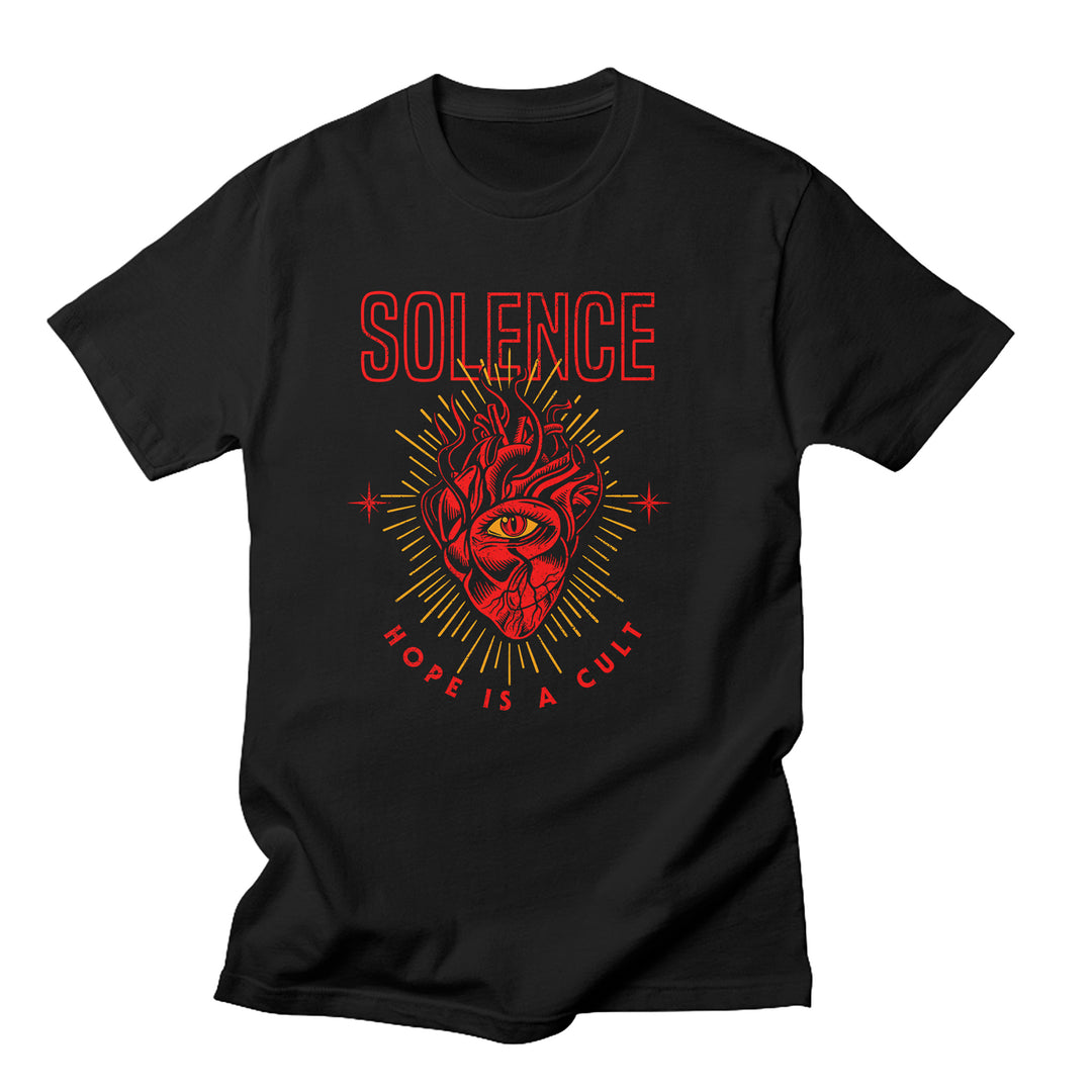 Solence black Gildan Softstyle t-shirt with an exclusive design: a red anatomical heart with a central eye and golden rays. SOLENCE is printed above in red, and HOPE IS A CULT appears in bold, curved text below.
