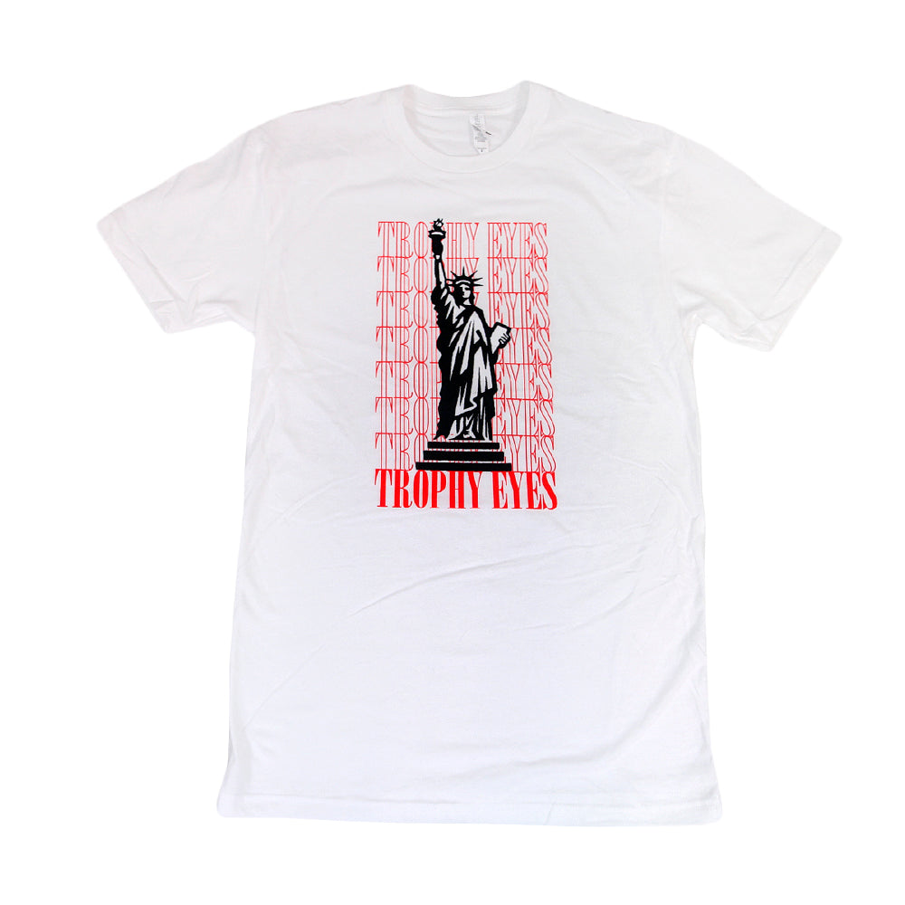 The Trophy Eyes Statue T-shirt features a bold black Statue graphic, repeated red TROPHY EYES text in the background, and a large TROPHY EYES logo at the bottom—a standout style from the Trophy Eyes brand.