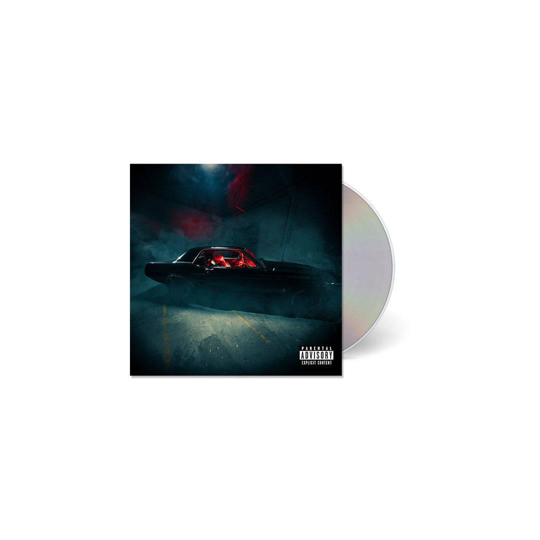 TX2 CD Walking Dead Man features a dark album cover with a person in a black car under moody lighting. Parental Advisory Explicit Content label is visible. The CD, partially behind the cover, displays the TX2 brand.