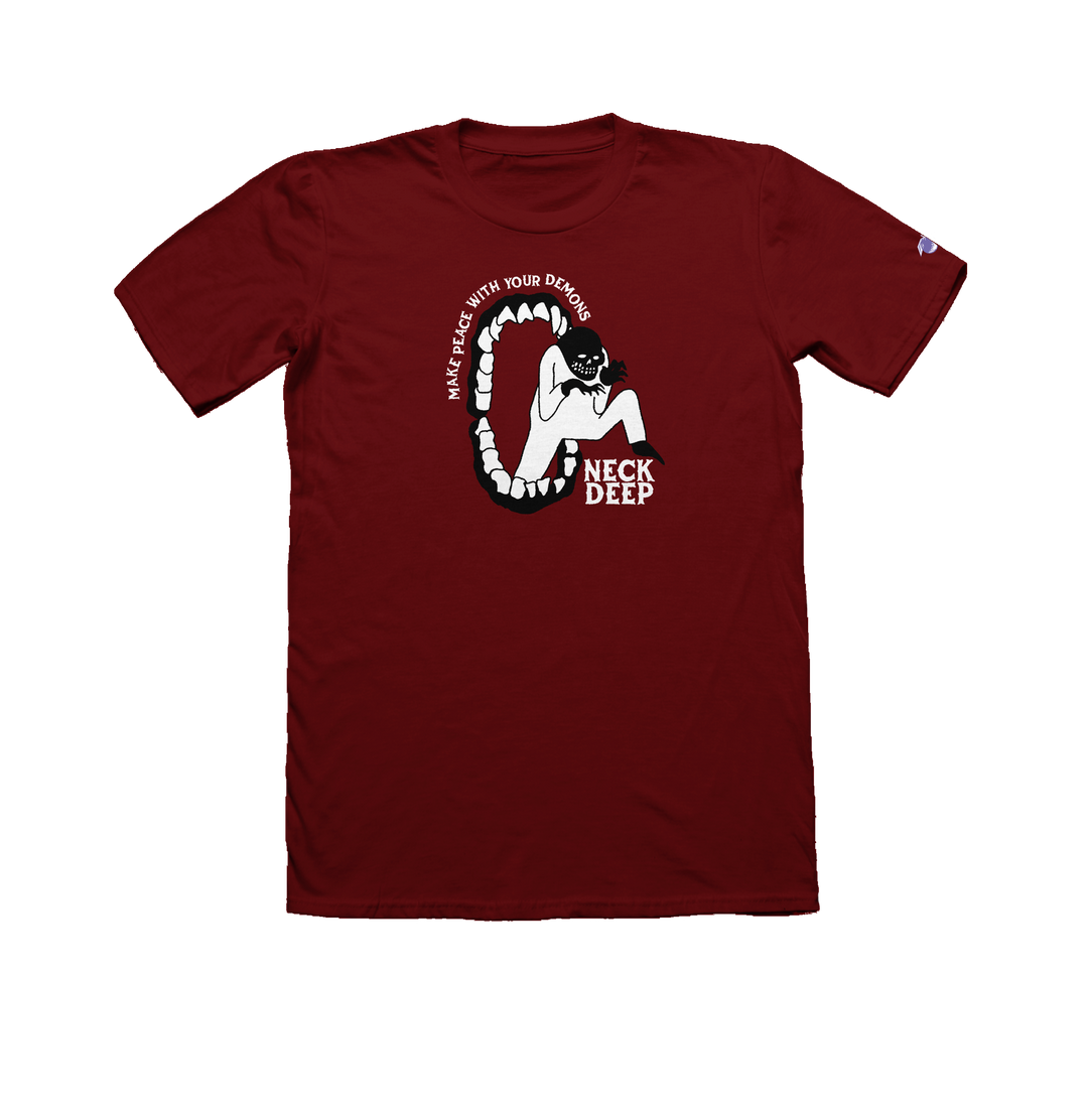 A maroon Neck Deep Gildan Hammer t-shirt featuring a Peace Demons design: a masked figure in an open mouth with sharp teeth, MAKE PEACE WITH YOUR DEMONS above and NECK DEEP below the image.