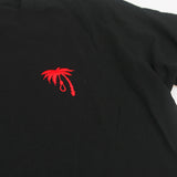 A black Trophy Eyes t-shirt featuring a small embroidered palm tree with a noose hanging from one branch on the left chest area.