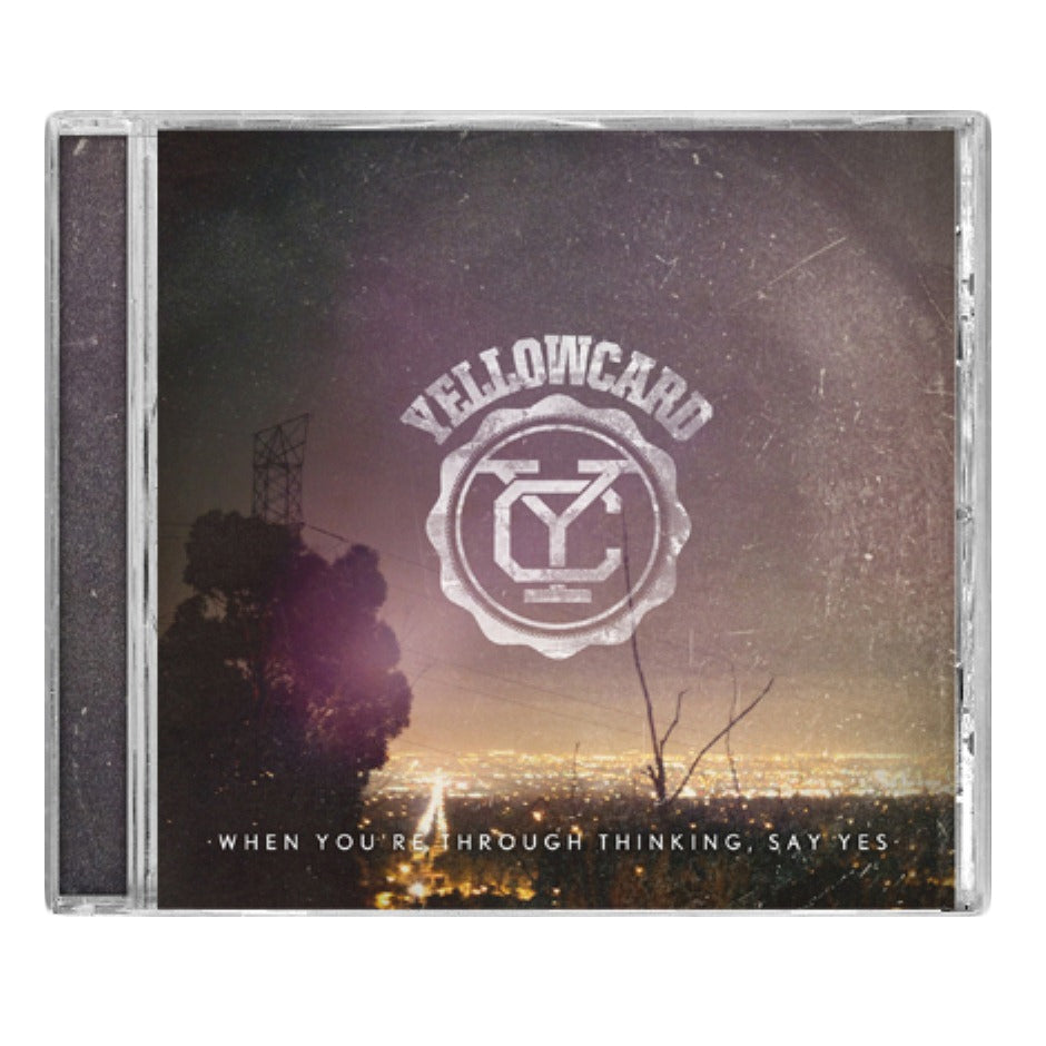 Yellowcard CD cover for When You’re Through Thinking, Say Yes features the band’s logo above a nighttime cityscape with silhouetted trees and powerlines, capturing this pop-punk album’s iconic style.