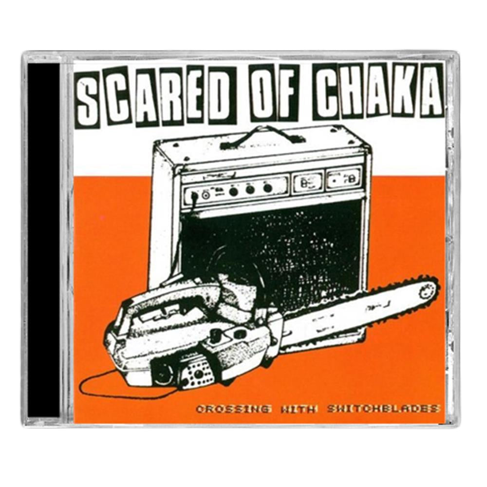 A Scared Of Chaka CD cover shows a black-and-white guitar amp and chainsaw on an orange background, with “SCARED OF CHAKA” at the top and “CROSSING WITH SWITCHBLADES” at the bottom. Song titles are printed inside.