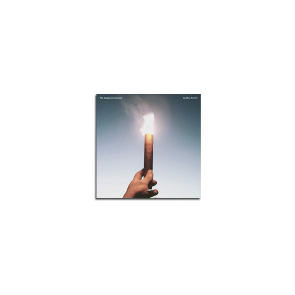A hand holds a large, lit matchstick upright against a clear sky, its bright flame and minimalist style echoing The Dangerous Summer’s aesthetic—like a Golden Record shining in the expanse above.