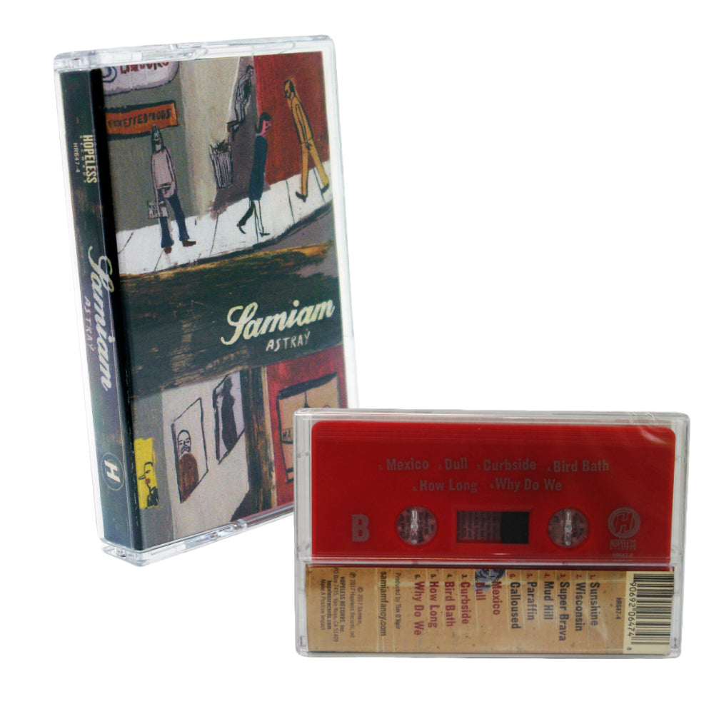A red Samiam cassette and case for their album. The cassette lists tracks, while the case shows illustrated street art with people by shops—an ideal collectible for music lovers.