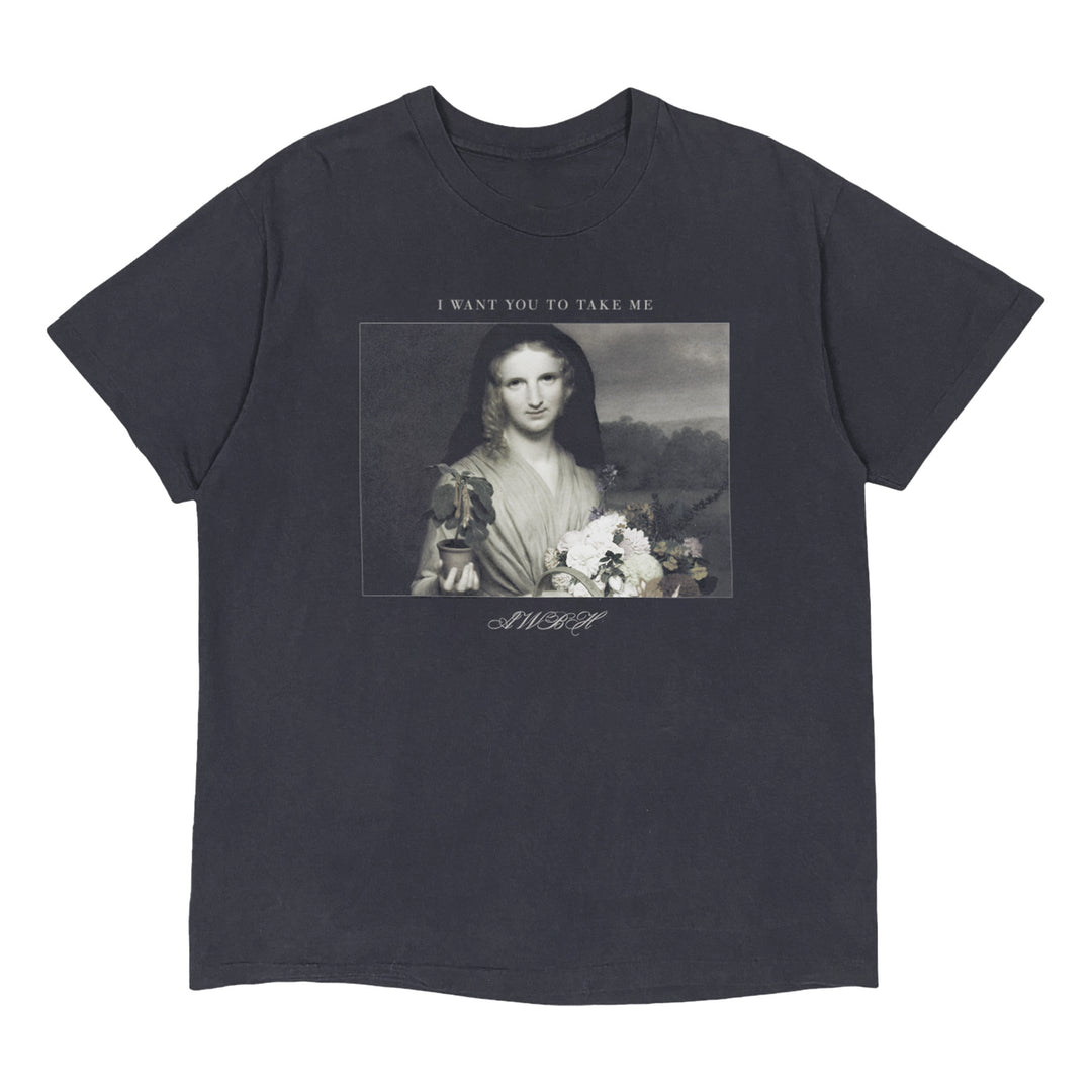 PVRIS black garment-dyed tee with an exclusive Mona Lisa holding flowers graphic. Text above reads “I WANT YOU TO TAKE ME,” and below, stylized “AWAY.” Inspired by classic shaka wear.