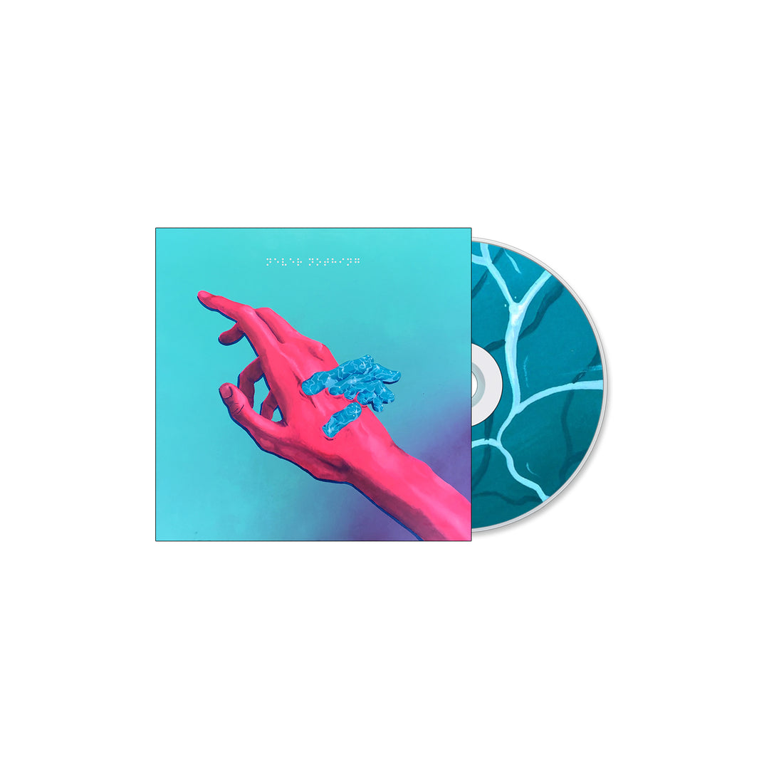 A Super Whatevr “Never Nothing” CD with a case featuring cover art of a pink hand with blue-painted fingers against teal, plus an abstract blue and white patterned disc and tracklist.