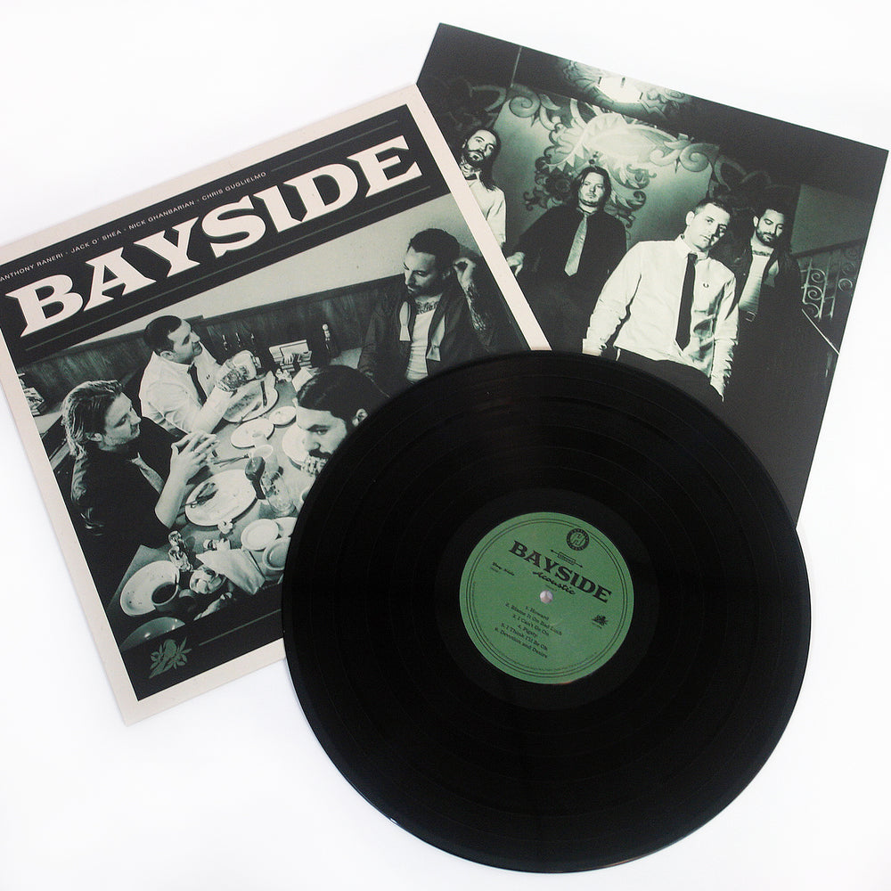 Vinyl Album cover for Bayside "Acoustic Volume 2" on a white background. Shows band eating at a diner with BAYSIDE in white text at the top. Black vinyl