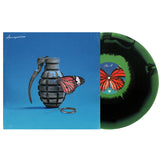 A vinyl record by Between You And Me partially pulled from its cover. The Pleased To Meet You edition shows a grenade with a butterfly on blue, and the limited green/black vinyl displays a red butterfly on the label.