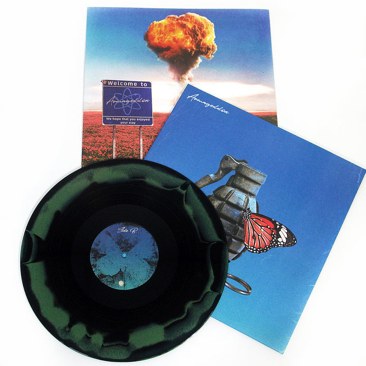 A black vinyl record by Between You And Me, Limited Edition, features grenade and butterfly artwork. The cover displays a mushroom cloud and a Welcome to Armageddon sign on a white background.