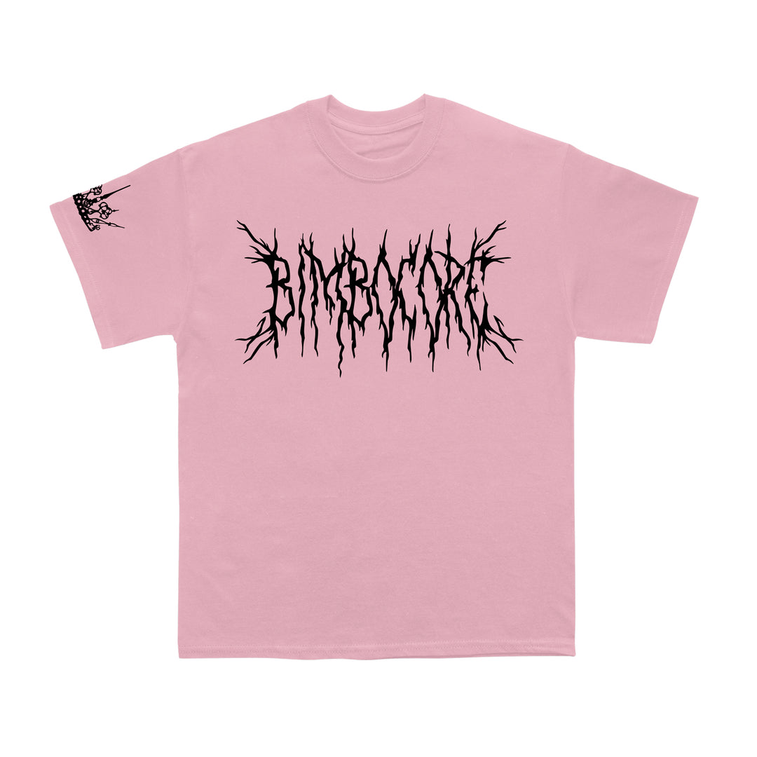 A pink Scene Queen Next Level t-shirt with black, spiky Bimbocore text on the chest and a skeletal hand rock gesture graphic on the left sleeve. Made from 100% cotton for comfort.