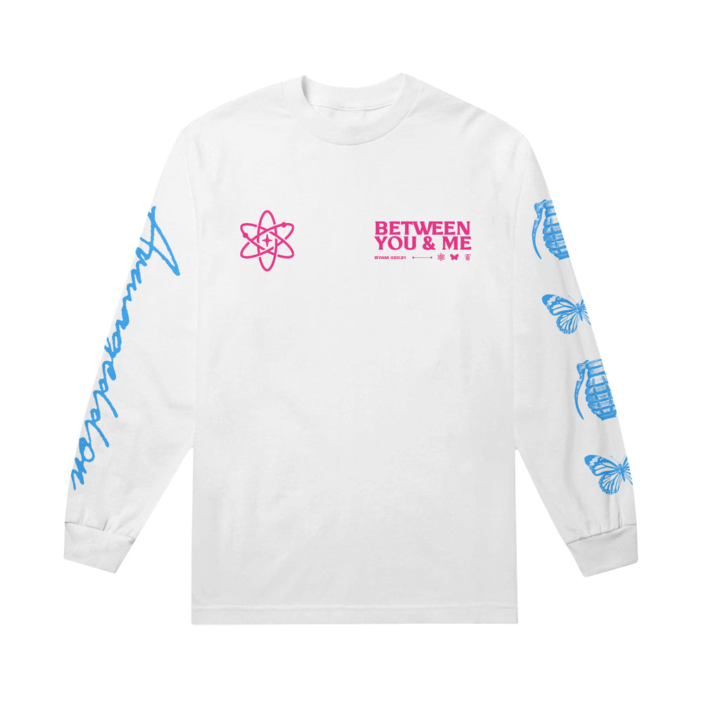 Between You And Me White Long Sleeve featuring pink BETWEEN YOU & ME text with atomic symbol on the chest, blue butterflies, grenades, and Imagination script on the sleeves for a unique Armageddon Long Sleeve style.