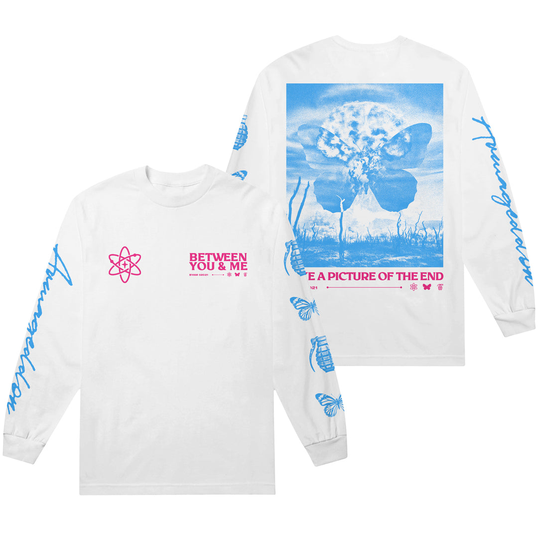 Stand out in this exclusive Between You And Me Gildan White Long Sleeve featuring blue “Armageddon” sleeve text, a pink atom on the front, and a bold melting butterfly graphic with “A Picture of the End” on the back.