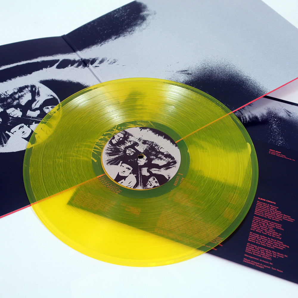 Vinyl album cover for Neck Deep "All Distortions Are Intentional" on a white background. Album cover is orange and depicts a purple orange in the meddle unpeeling to show earth.  Vinyl is Transparent Yellow. 