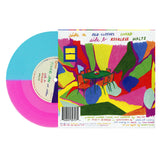 A colorful vinyl record, half blue and neon magenta, by Tigers Jaw rests next to its vivid abstract sleeve—featuring a bright table and chairs illustration with the tracklisting and production details displayed.