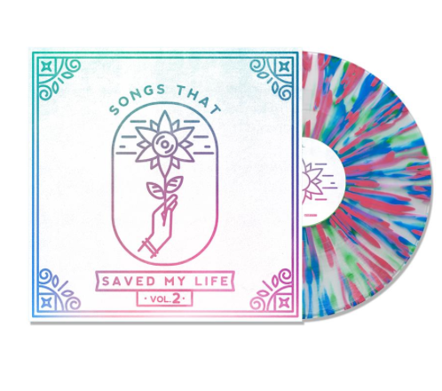 A vibrant, cloudy-clear vinyl from Songs That Saved My Life features splashes of pink, blue, and green beside its cover, which displays a hand holding a sunflower, the tracklist, and the title “Songs That Saved My Life Volume 2.”.