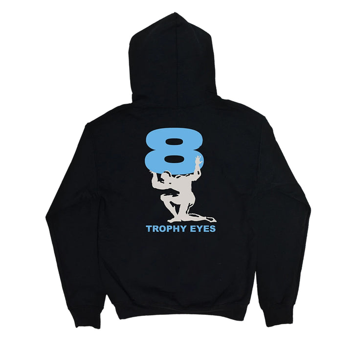 A black 100% cotton Trophy Eyes hoodie with a large light blue number 8 on the back. Below, a white silhouette holds the 8, and "TROPHY EYES" appears in blue underneath.