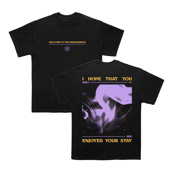 Between You And Me’s exclusive Next Level Black Tee features WELCOME TO THE ARMAGEDDON and a symbol on the front, with abstract purple artwork and bold yellow text on the back.